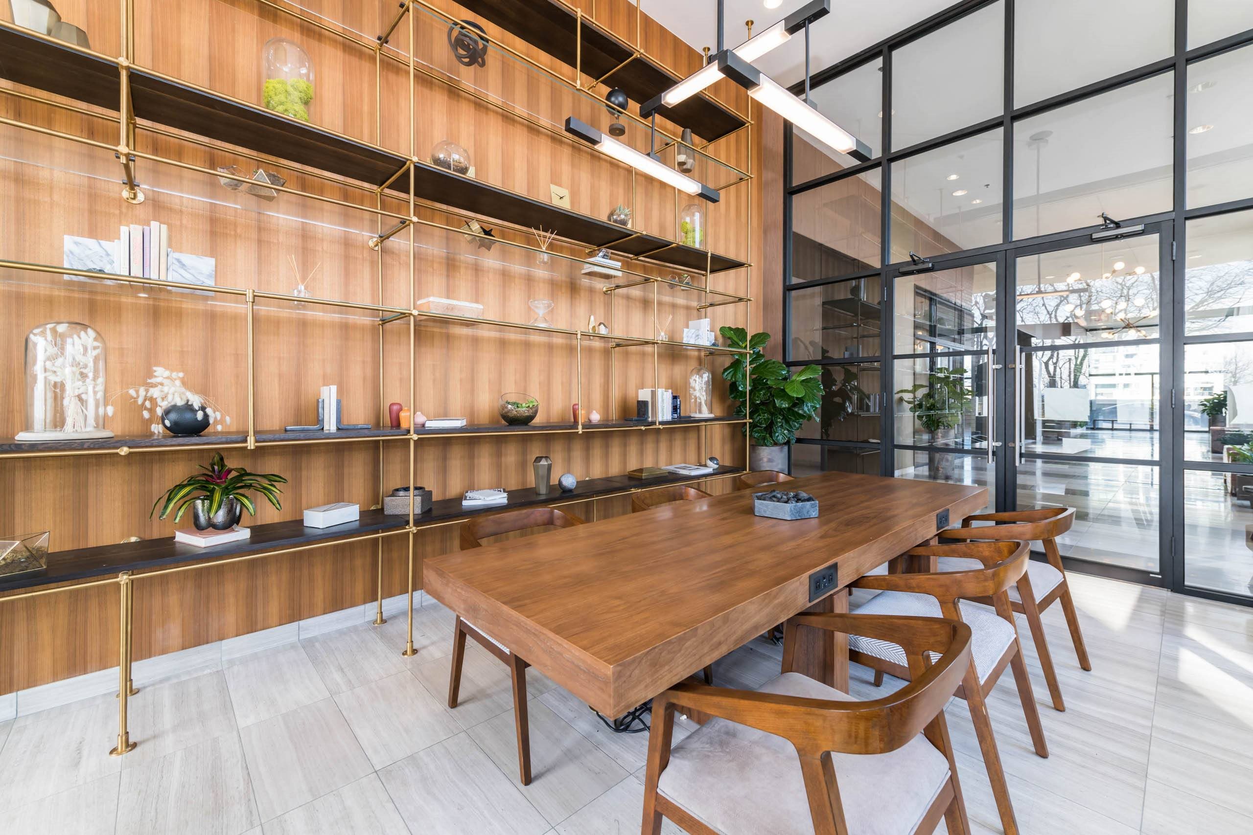 a dining room with a long wooden table and chairs at North Harbor Tower, Illinois, 60601